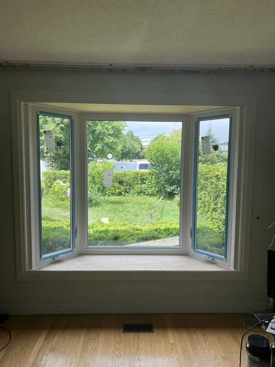 Finished bay window from inside the Brampton home, white interior with a wide new sill