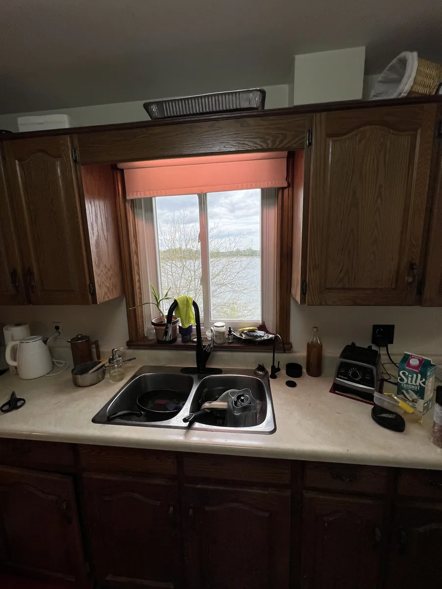 Small kitchen window over the sink before enlargement, with Professor's Lake visible outside