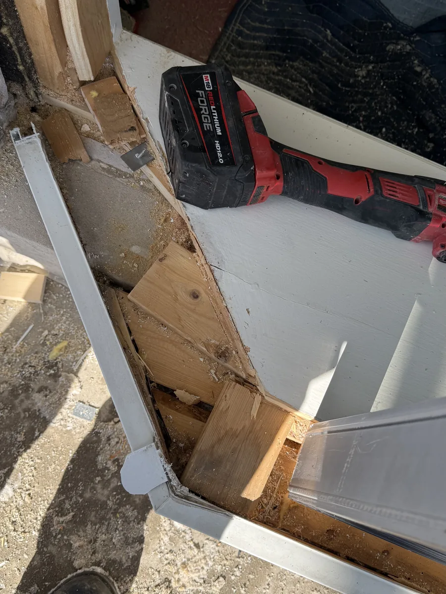 A window opening stripped to the framing and being rebuilt before the new unit goes in