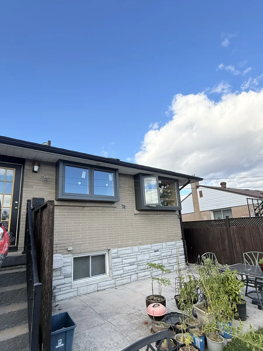 Both Ash Gray box windows projecting from the rear wall of the Oshawa home